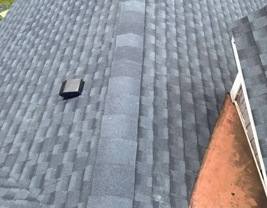 Charcoal gray shingle roof ridge cap replacement in Westchester NY