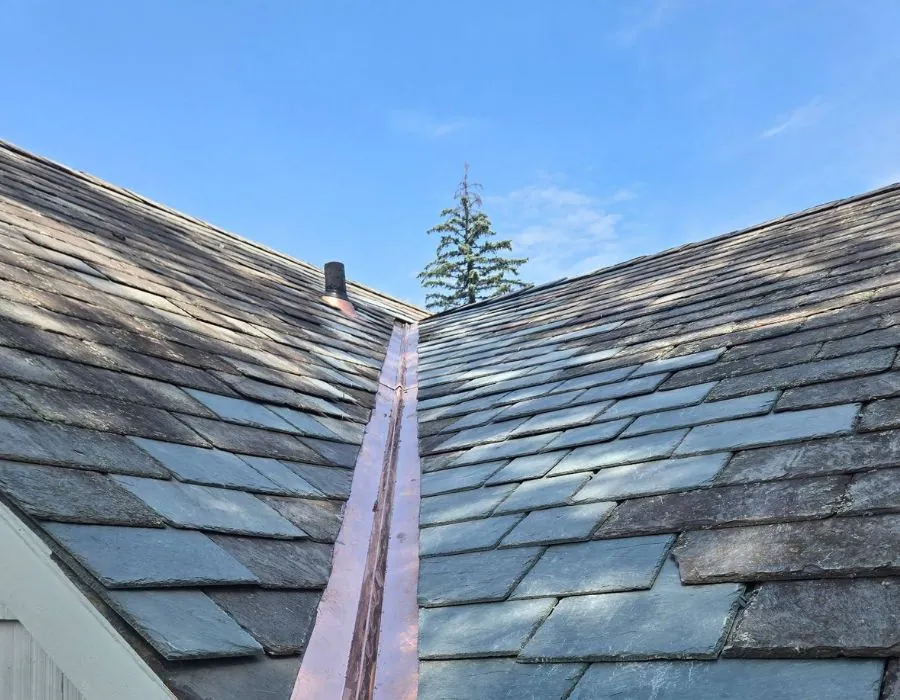 Slate roof repair with copper valley in Westchester County