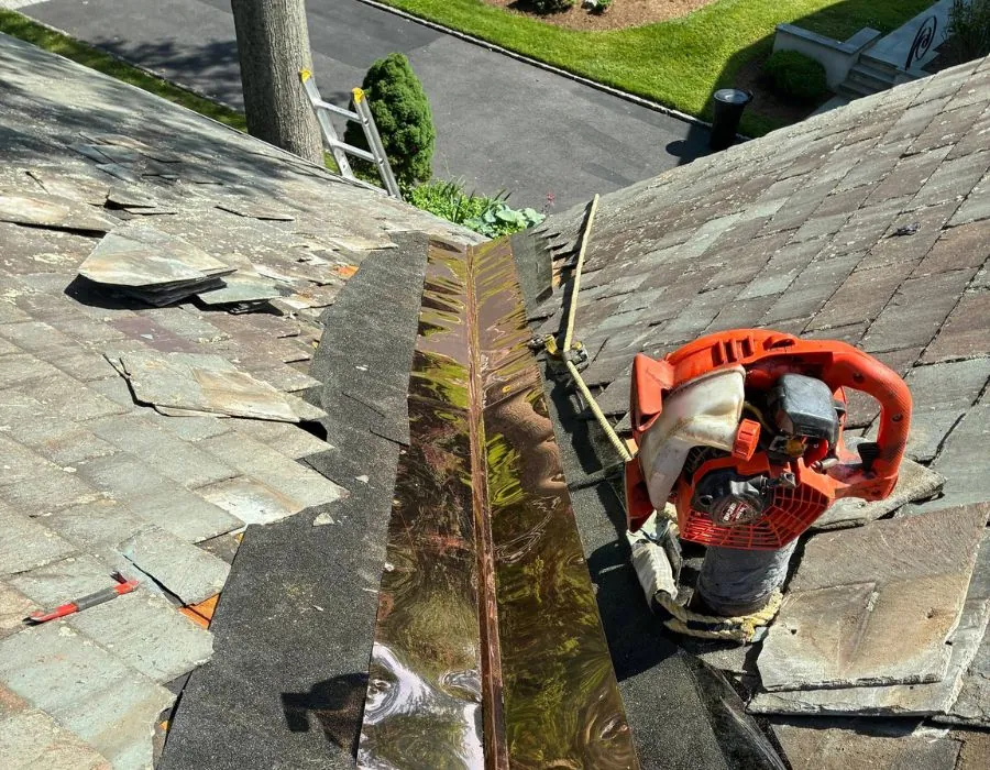 Copper valley flashing installation on slate roof in Westchester County