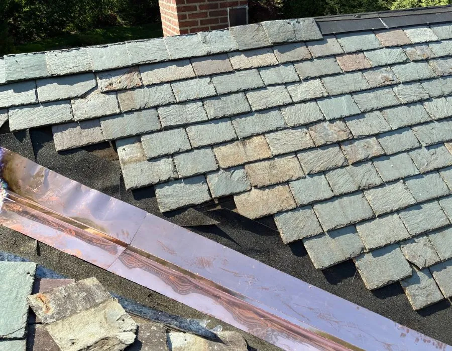 Green slate roof repair with coper valley flashing in Westchester County