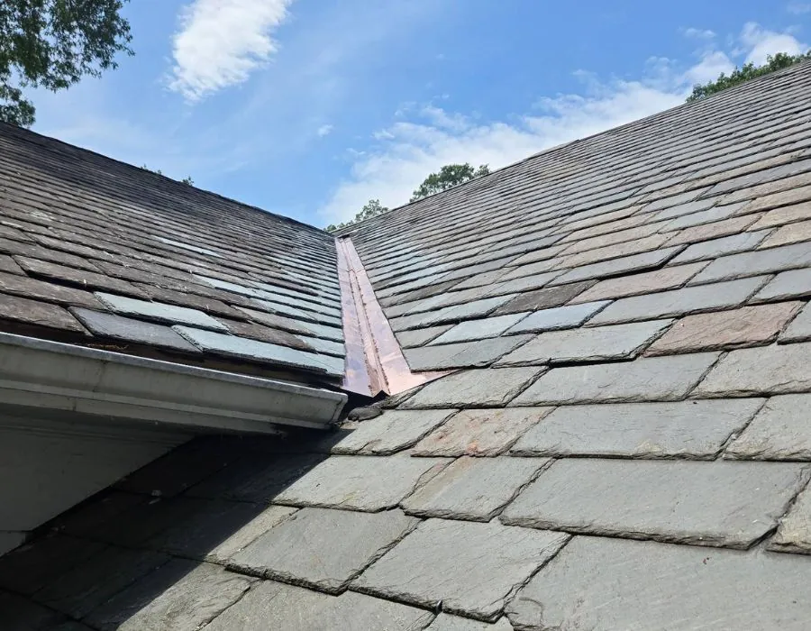 Slate roof copper valley installation in Westchester County