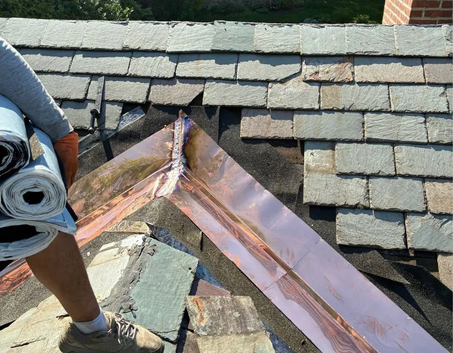 Soldered copper valley flashes on slate roof in Westchester County