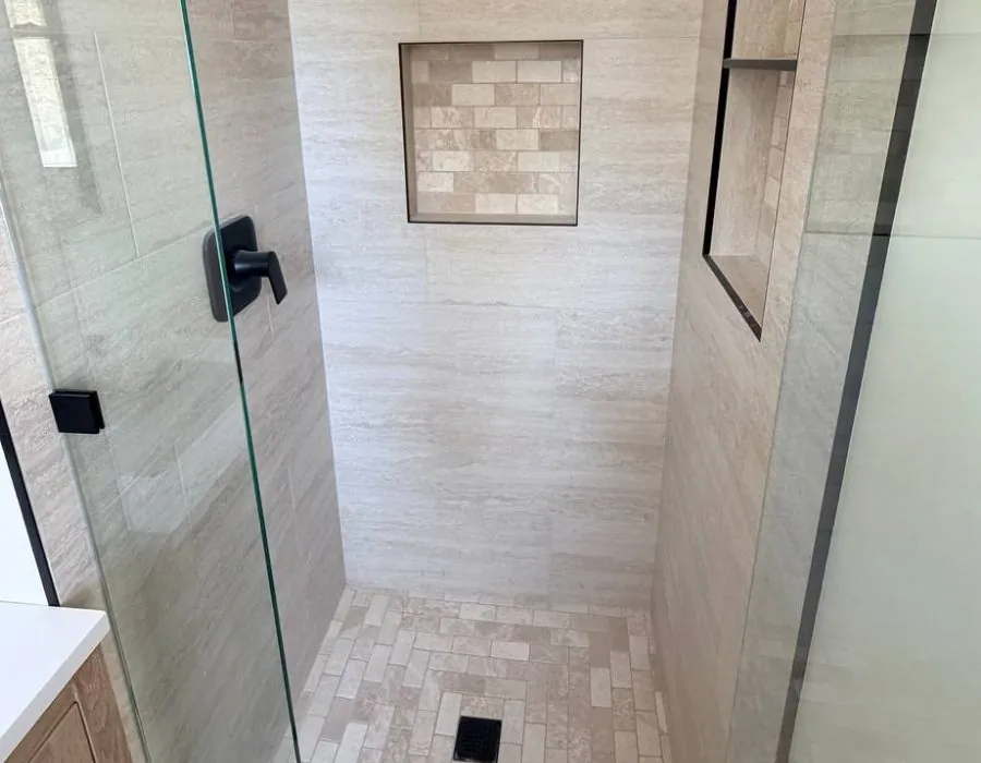 Walk in shower with stone niche